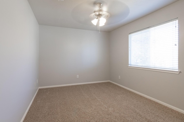 carpeted empty room with ceiling fan