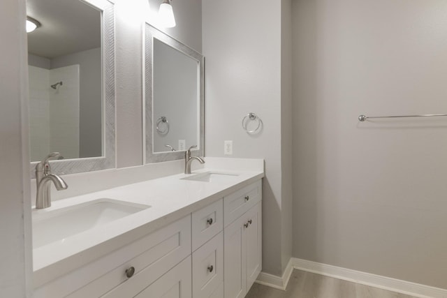 bathroom with vanity and wood-type flooring