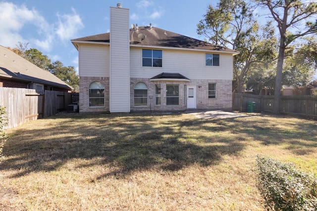 back of property featuring cooling unit, a lawn, and a patio area