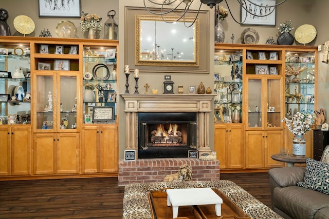 living room with a fireplace and dark hardwood / wood-style floors