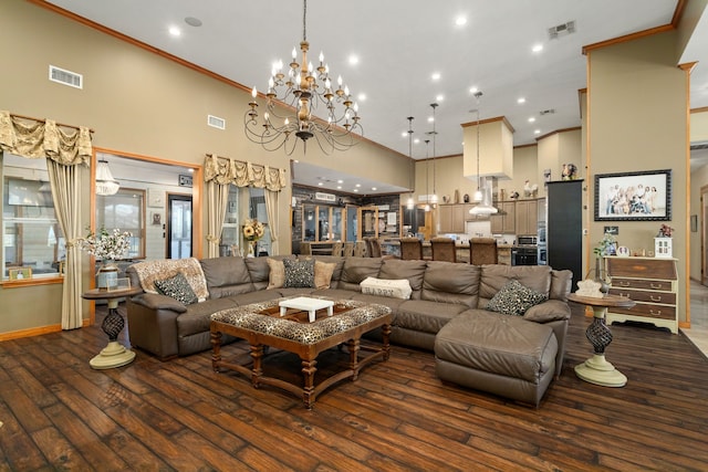 living room featuring dark hardwood / wood-style flooring, a high ceiling, and an inviting chandelier