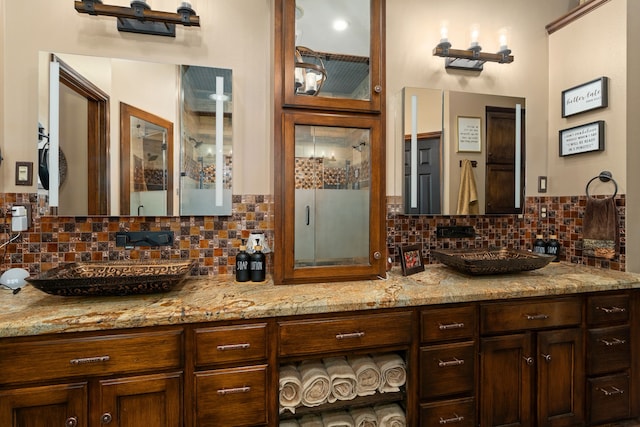 bathroom with tasteful backsplash and vanity