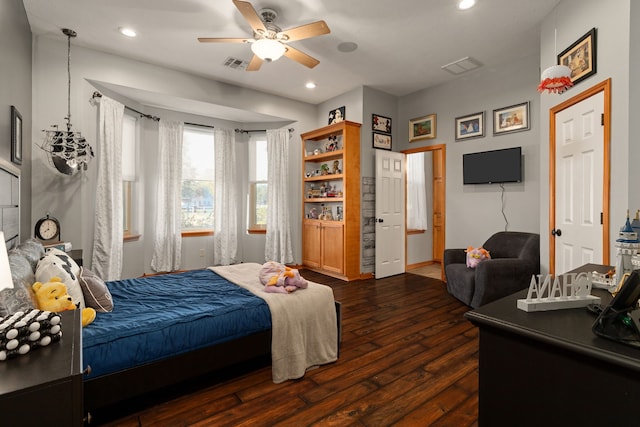 bedroom featuring dark hardwood / wood-style floors and ceiling fan