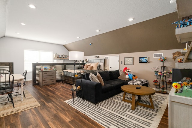 living room with dark hardwood / wood-style flooring and vaulted ceiling