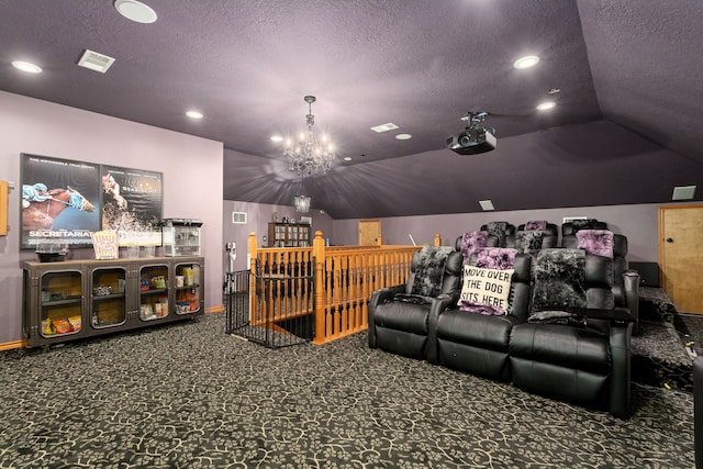 cinema room featuring vaulted ceiling, a textured ceiling, and an inviting chandelier