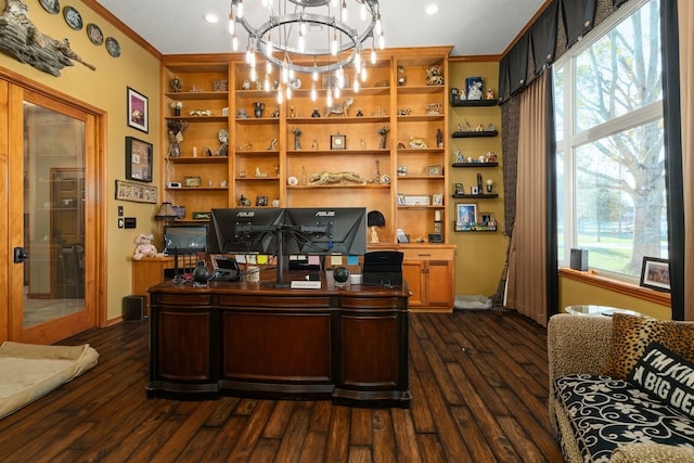 office area featuring dark hardwood / wood-style flooring, ornamental molding, and an inviting chandelier