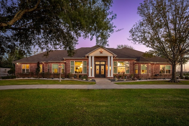 view of front of property with a lawn