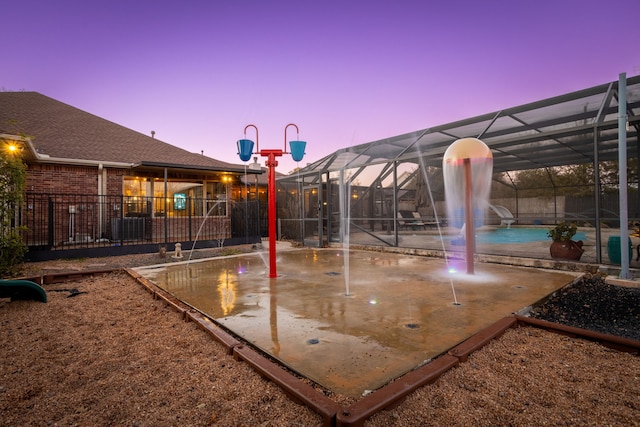 view of sport court featuring pool water feature