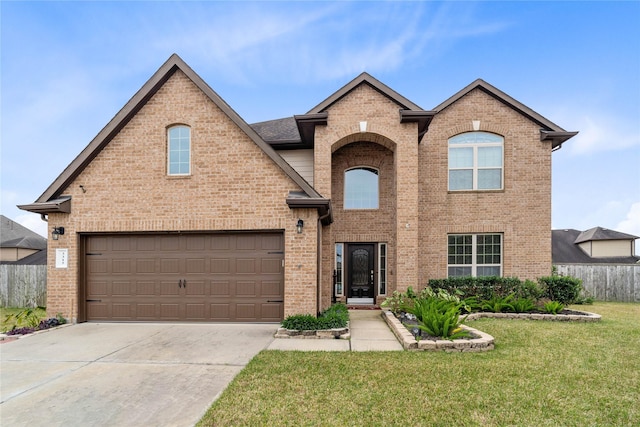 front of property featuring a garage and a front lawn