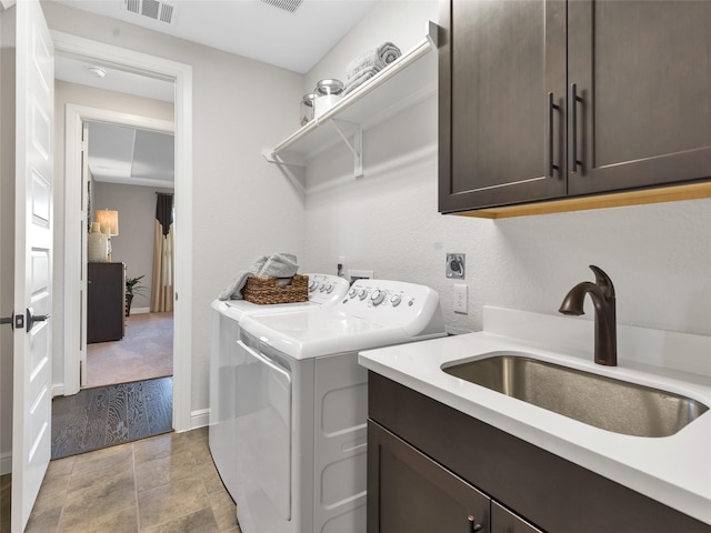 1412 River Point Dr, Friendswood, TX 77546 - laundry room featuring cabinet space, washer and clothes dryer, and baseboards