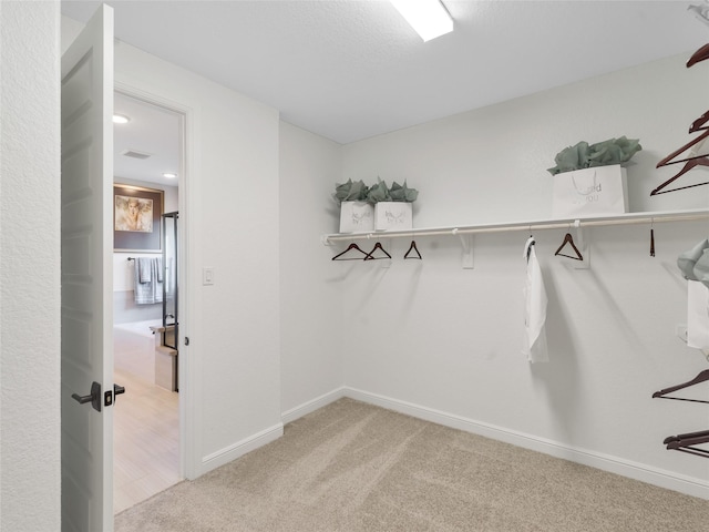 1412 River Point Dr, Friendswood, TX 77546 - walk in closet with carpet flooring
