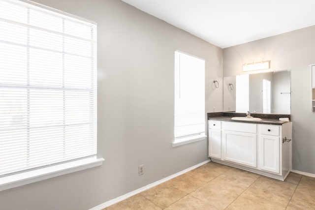 bathroom featuring tile patterned flooring and vanity