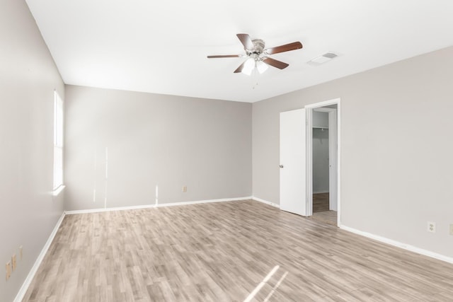 unfurnished room featuring ceiling fan and light hardwood / wood-style flooring