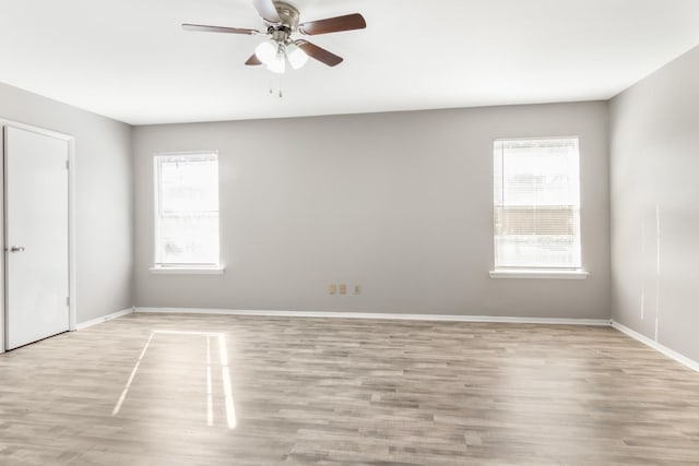 unfurnished room featuring ceiling fan and light hardwood / wood-style flooring