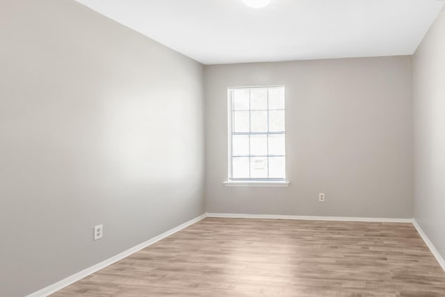 unfurnished room featuring light hardwood / wood-style floors