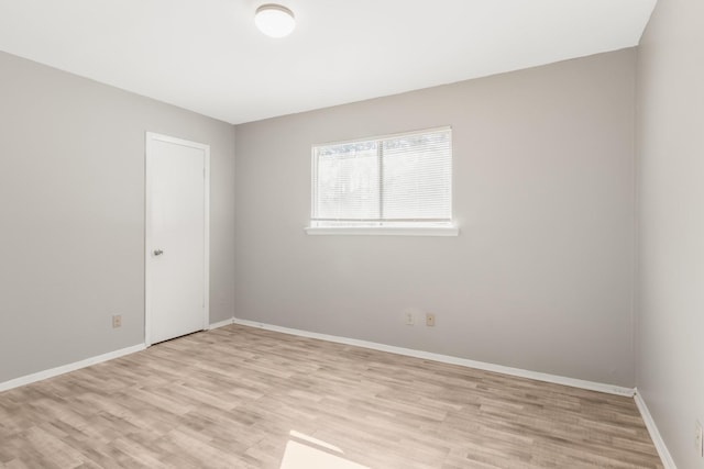 spare room featuring light hardwood / wood-style flooring