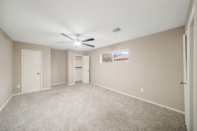 unfurnished bedroom featuring carpet and ceiling fan