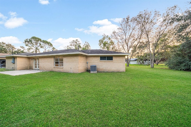 exterior space featuring a lawn, central AC, and a patio area