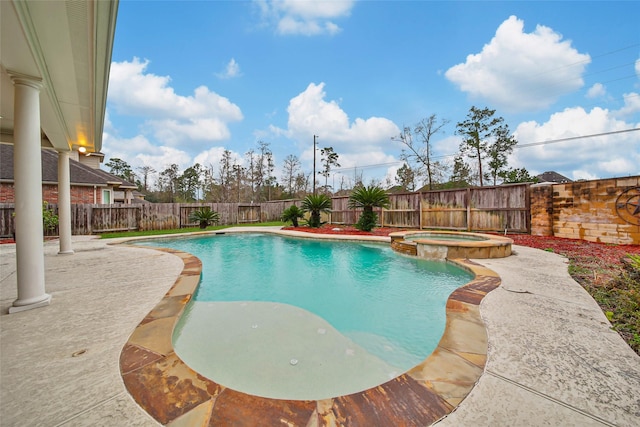 view of swimming pool featuring a patio area, a fenced backyard, and a pool with connected hot tub