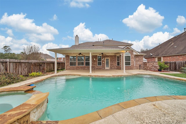 view of swimming pool featuring a patio area, ceiling fan, a pool with connected hot tub, and a fenced backyard