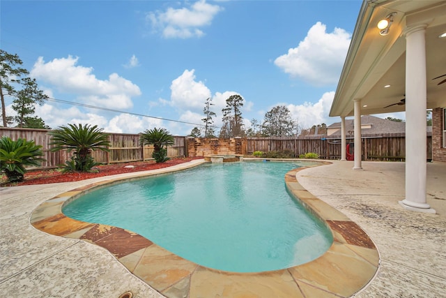 view of swimming pool featuring a ceiling fan, a fenced backyard, and a patio