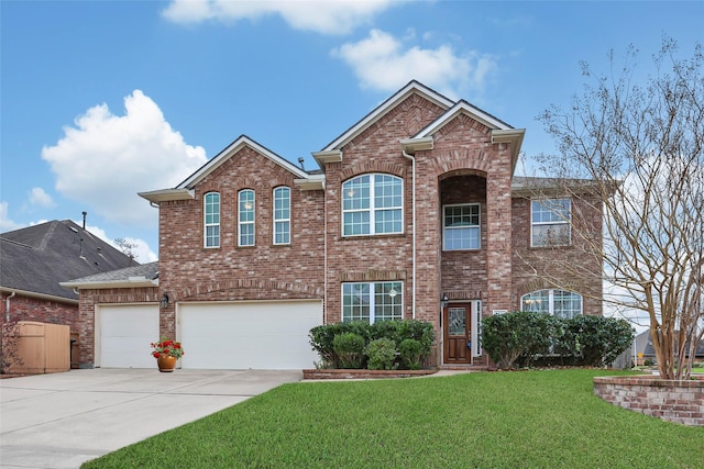 view of front of house featuring a garage and a front lawn