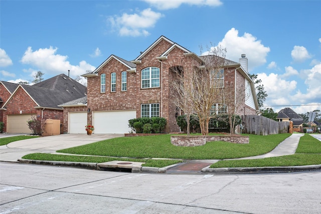 traditional-style home featuring a front yard, brick siding, driveway, and fence