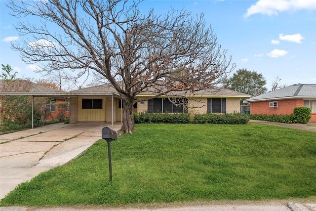 single story home with a carport and a front yard