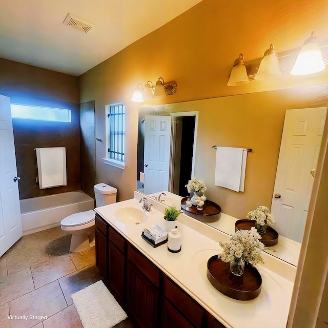 bathroom featuring tile patterned floors, vanity, and toilet