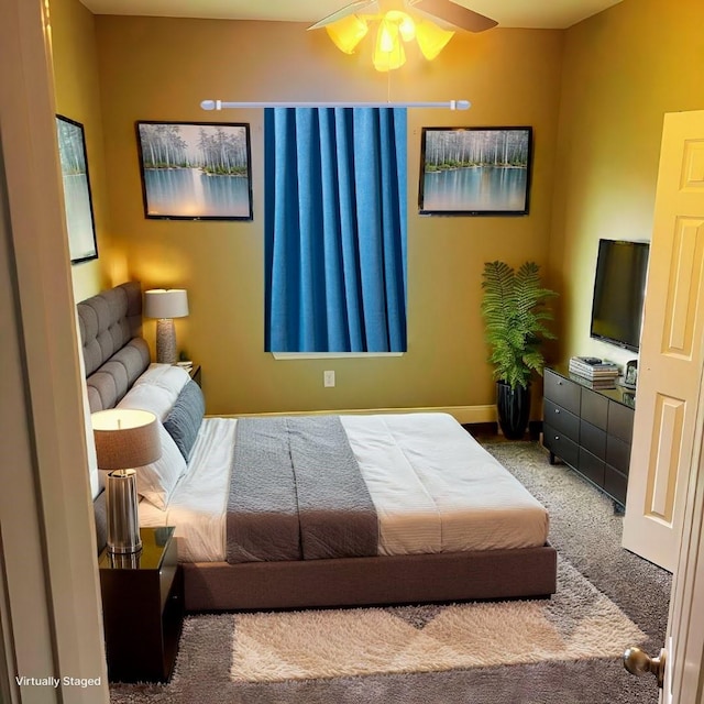 carpeted bedroom with ceiling fan