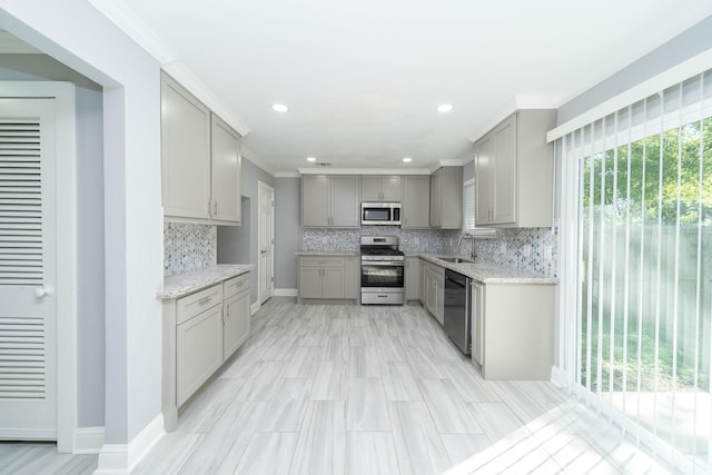 kitchen with gray cabinets, sink, and stainless steel appliances