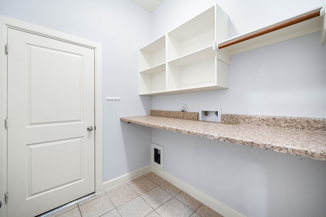 laundry room featuring hookup for an electric dryer, hookup for a washing machine, and light tile patterned floors