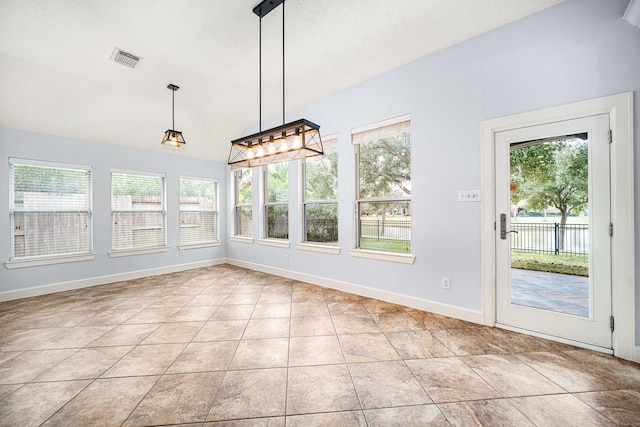 unfurnished sunroom with lofted ceiling