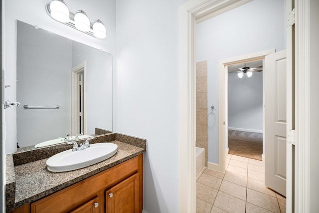 bathroom with tile patterned floors, ceiling fan, vanity, and tub / shower combination