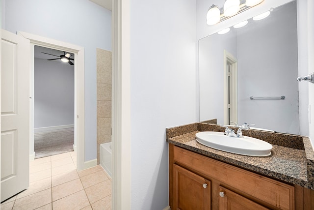 bathroom with ceiling fan, tile patterned flooring, and vanity