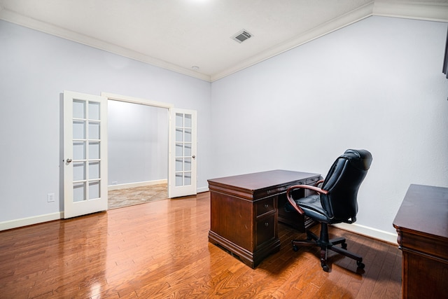 office space with hardwood / wood-style floors, ornamental molding, and french doors