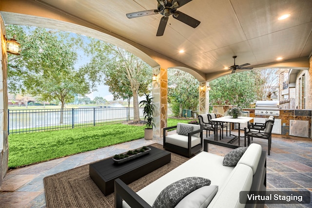 view of patio with outdoor lounge area, grilling area, a water view, ceiling fan, and area for grilling