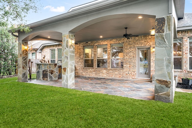 exterior space featuring ceiling fan