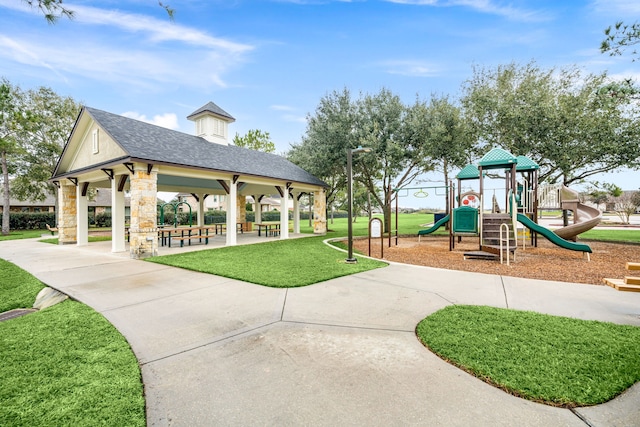 exterior space featuring a lawn, a gazebo, and a playground