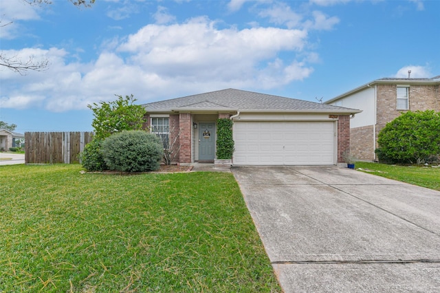 view of front of house featuring a front yard and a garage