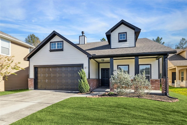 view of front of property with a front lawn, covered porch, and a garage