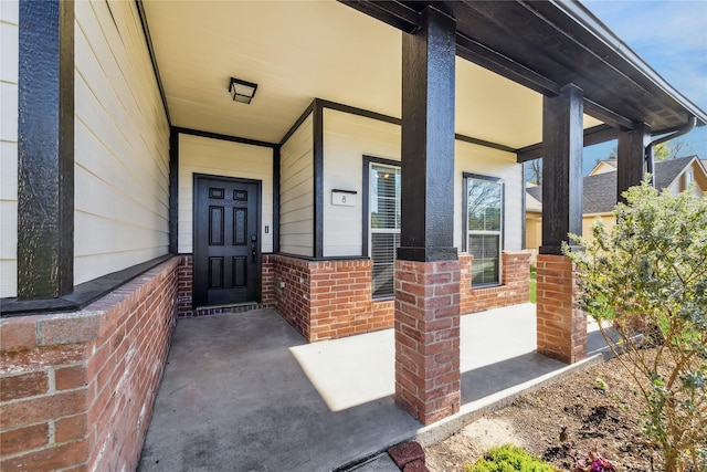 entrance to property featuring a porch