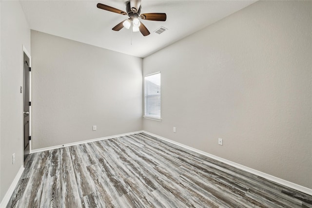 unfurnished room with ceiling fan and wood-type flooring