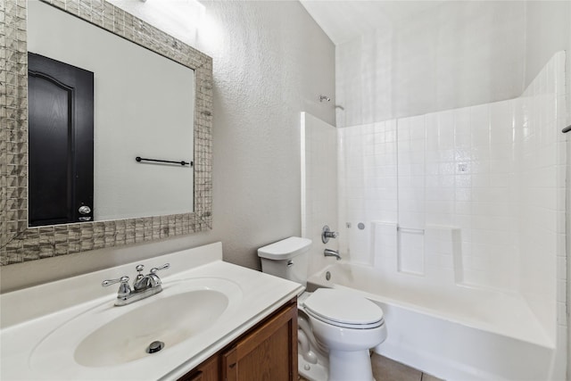 full bathroom featuring vanity, bathtub / shower combination, and toilet