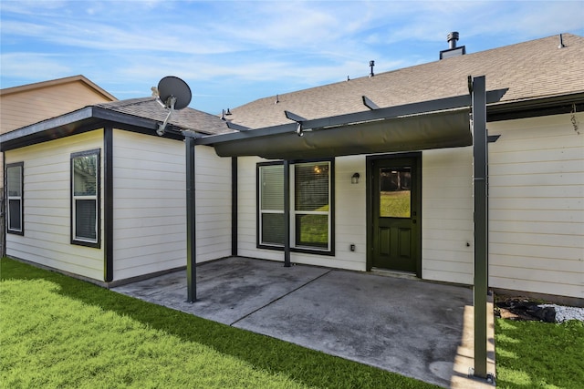 back of house featuring a yard and a patio