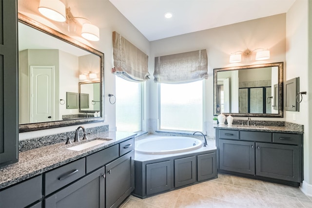 bathroom featuring tile patterned flooring, vanity, and independent shower and bath