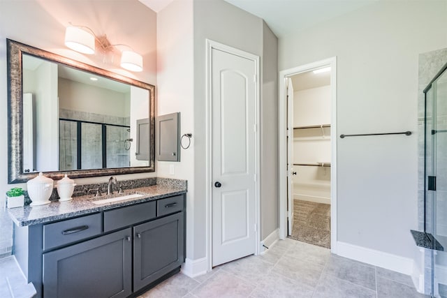 bathroom featuring vanity and an enclosed shower