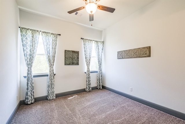 empty room featuring carpet and ceiling fan