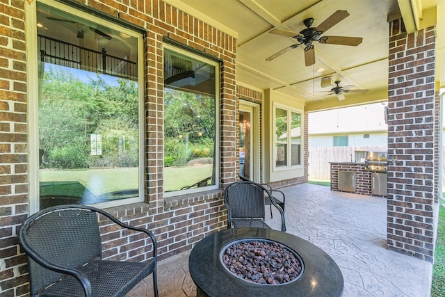 view of patio with ceiling fan and exterior kitchen