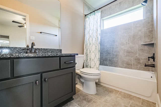 full bathroom featuring vanity, ceiling fan, toilet, and shower / tub combo